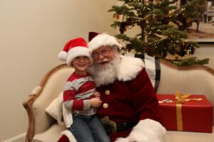 Santa Dale with a Future Santa's Helper. Look at that hat!